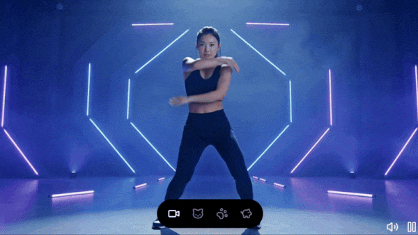 A dancing woman morphs into a black cat, then a monkey, and finally a pig under neon hexagon lights, illustrating xAI’s video generator capabilities.