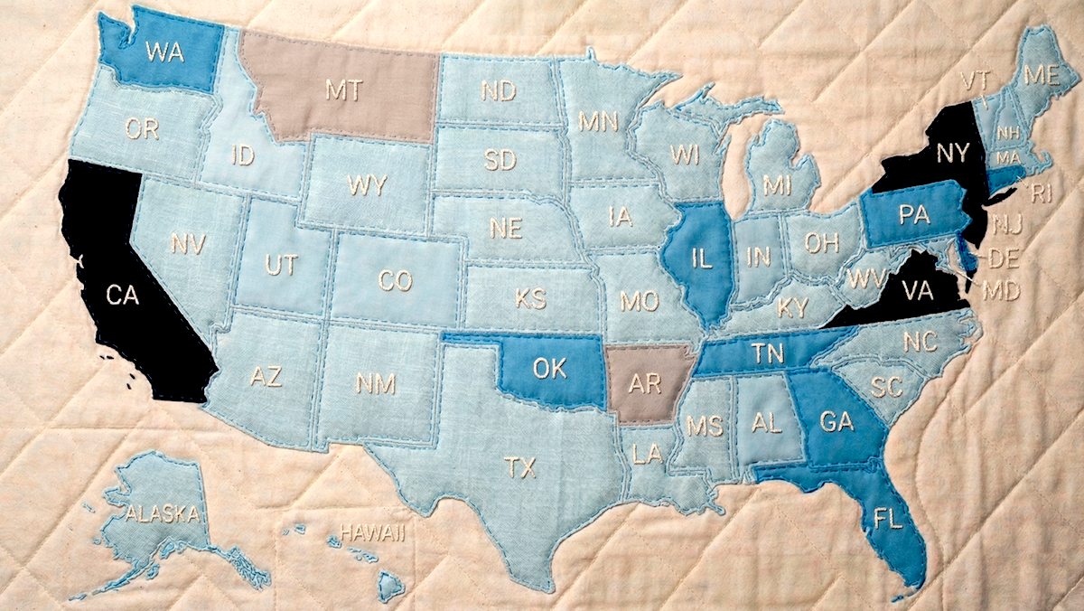 Quilt map of U.S. states with varying shades, some states in black, illustrating AI legislation differences.