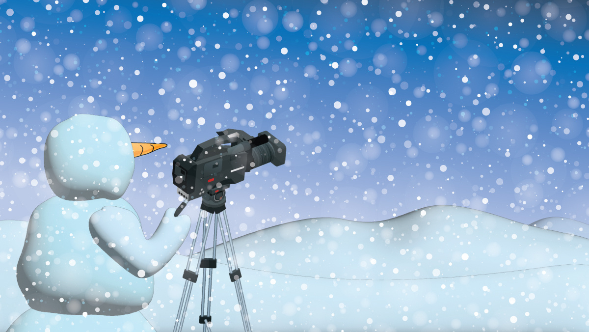 Snowman using a camera during snowfall.