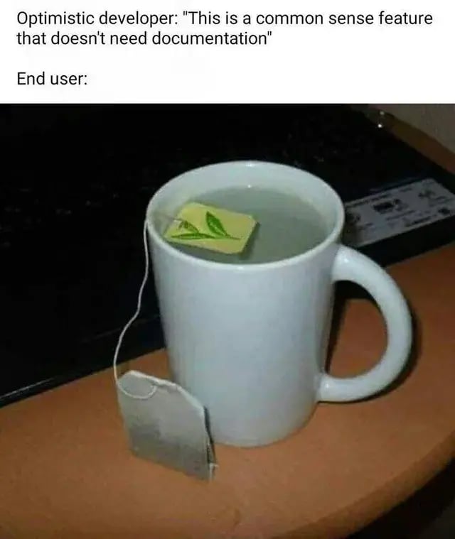 Meme shows: “Optimistic developer: ‘This is a common sense feature that doesn’t need documentation.’ End user:” with image of a tea bag dunked by the paper tag instead of the bag, highlighting poor UX assumptions.